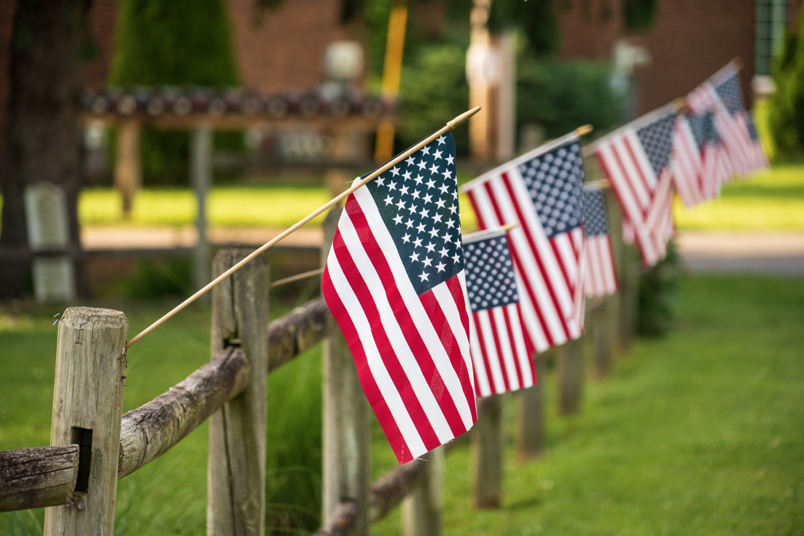 American flags on fence
