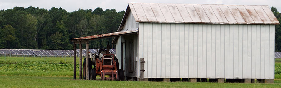 Tractor in front of shed