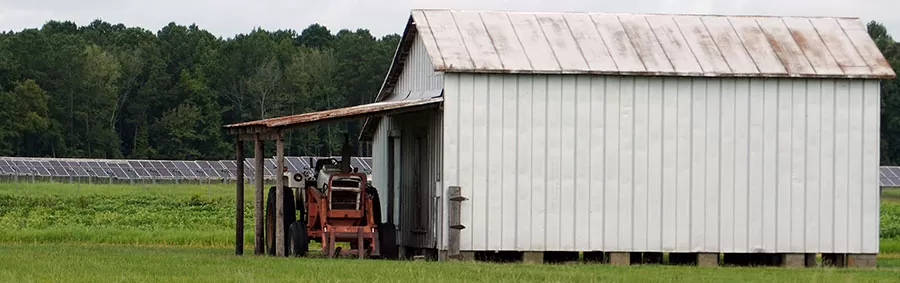 Tractor in front of shed